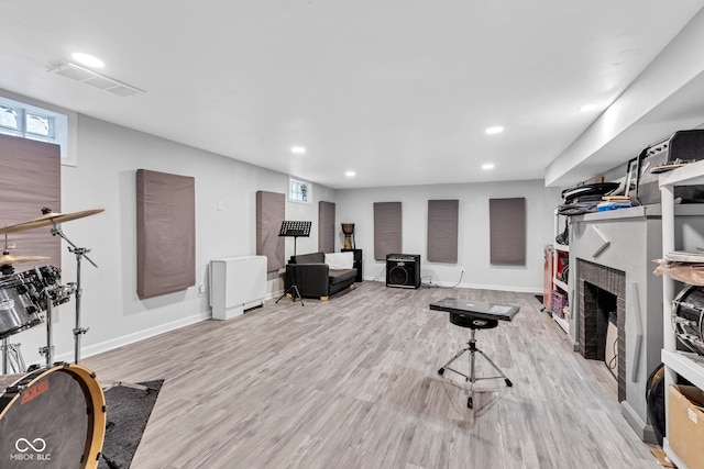 1618 Villa Ave, Indianapolis, IN 46203 - living room featuring wood finished floors, recessed lighting, baseboards, and a fireplace