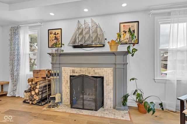 1618 Villa Ave, Indianapolis, IN 46203 - detailed view of a tiled fireplace, recessed lighting, and wood finished floors