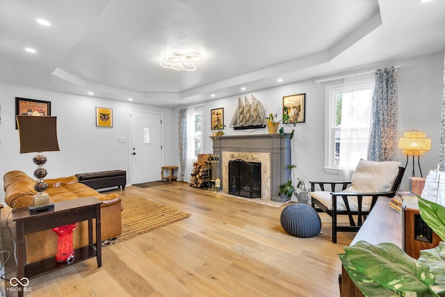 1618 Villa Ave, Indianapolis, IN 46203 - living room featuring a raised ceiling, wood finished floors, a fireplace with flush hearth, and recessed lighting