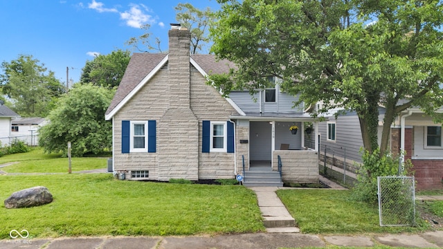 1618 Villa Ave, Indianapolis, IN 46203 - view of front of home featuring a porch, stone siding, a chimney, and a shingled roof