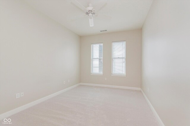 355 E Ohio St Unit 209, Indianapolis, IN 46204 - empty room with light colored carpet, a ceiling fan, and baseboards