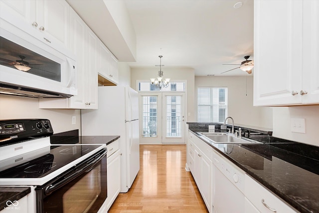 355 E Ohio St Unit 209, Indianapolis, IN 46204 - kitchen featuring white appliances, a sink, white cabinets, and light wood-style floors