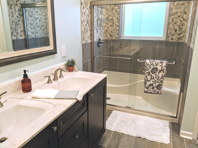 10421 Sand Creek Blvd, Fishers, IN 46037 - full bath featuring double vanity, an enclosed shower, and wood finished floors
