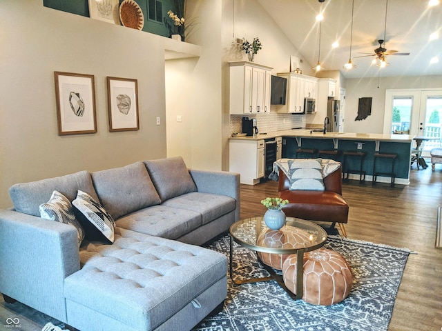 10421 Sand Creek Blvd, Fishers, IN 46037 - living room featuring dark wood-style flooring, ceiling fan, high vaulted ceiling, and beverage cooler