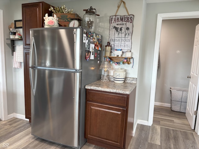 260 S 250 W, Greenfield, IN 46140 - kitchen with freestanding refrigerator, wood finished floors, baseboards, and open shelves