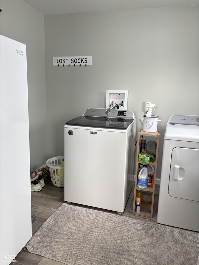 260 S 250 W, Greenfield, IN 46140 - laundry area featuring washer and dryer and wood finished floors