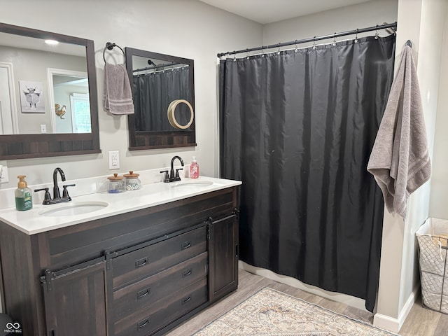 260 S 250 W, Greenfield, IN 46140 - full bath with wood finished floors, double vanity, baseboards, and a shower with curtain