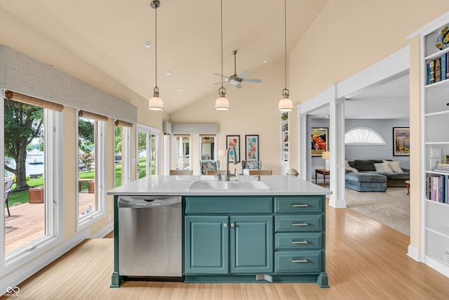 103 Gettysburg, Coatesville, IN 46121 - kitchen with stainless steel dishwasher, open floor plan, a ceiling fan, light countertops, and light wood-type flooring