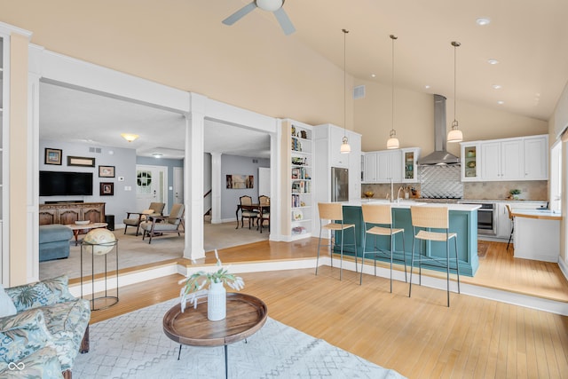 103 Gettysburg, Coatesville, IN 46121 - living area featuring light wood-style floors, a ceiling fan, and high vaulted ceiling