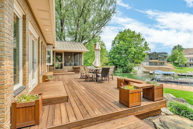 103 Gettysburg, Coatesville, IN 46121 - wooden terrace with a sunroom and outdoor dining area