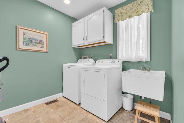 103 Gettysburg, Coatesville, IN 46121 - laundry area with cabinet space and separate washer and dryer