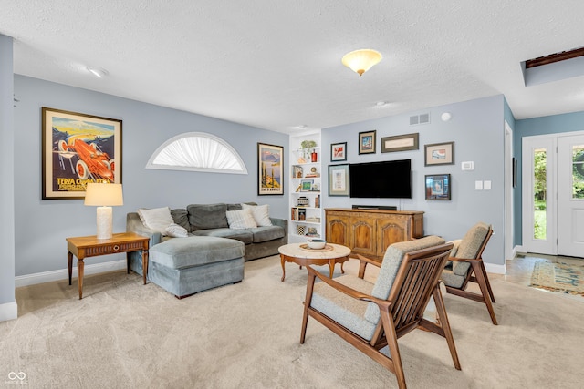 103 Gettysburg, Coatesville, IN 46121 - living area with light carpet, a textured ceiling, and built in features