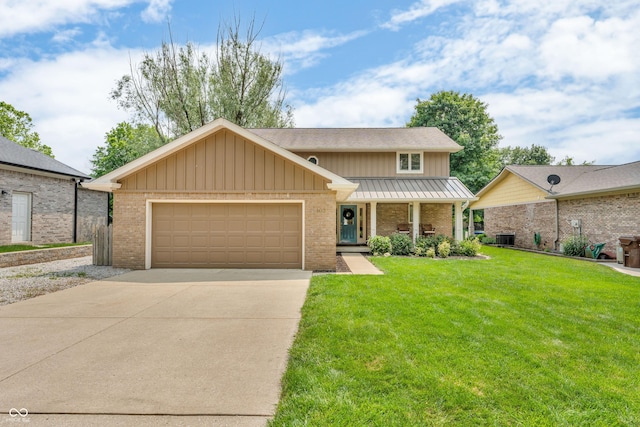 103 Gettysburg, Coatesville, IN 46121 - traditional-style house with board and batten siding, an attached garage, concrete driveway, and brick siding