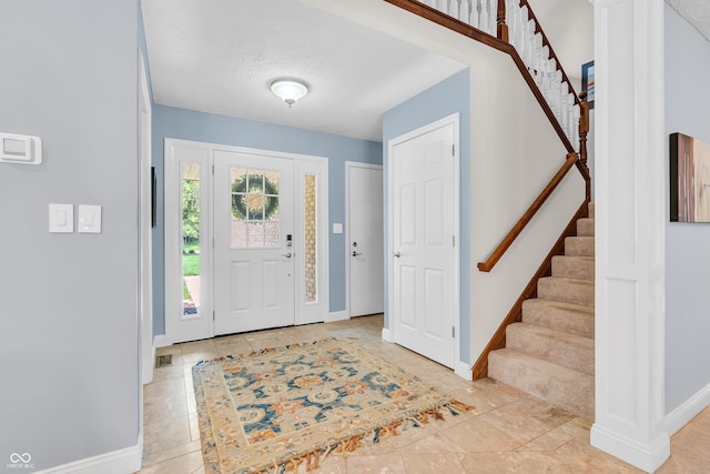 103 Gettysburg, Coatesville, IN 46121 - entrance foyer with stairway and light tile patterned floors