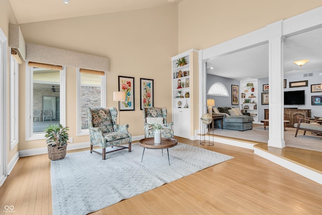 103 Gettysburg, Coatesville, IN 46121 - living area with decorative columns, wood finished floors, and high vaulted ceiling