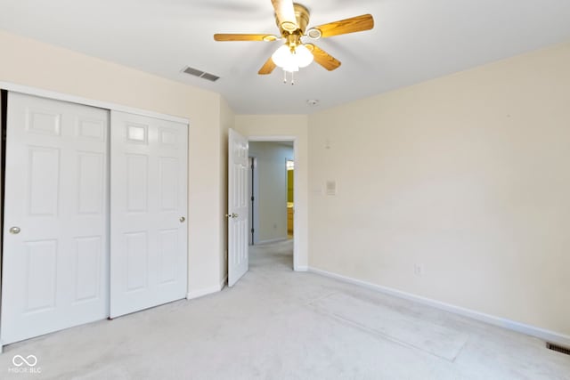 11036 Ravenna Way, Indianapolis, IN 46236 - unfurnished bedroom with light carpet, a closet, baseboards, and a ceiling fan