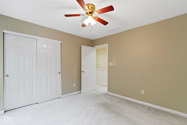 11036 Ravenna Way, Indianapolis, IN 46236 - unfurnished bedroom with light colored carpet, a closet, baseboards, and a ceiling fan