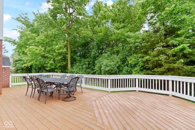 11036 Ravenna Way, Indianapolis, IN 46236 - wooden deck featuring outdoor dining area and view of wooded area