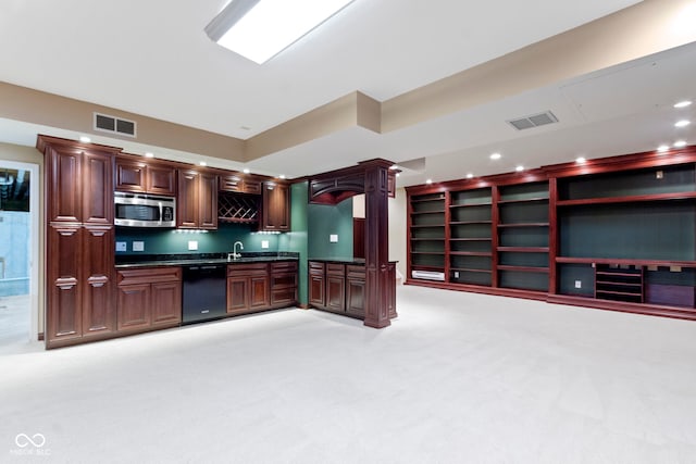 11036 Ravenna Way, Indianapolis, IN 46236 - kitchen with dishwasher, stainless steel microwave, dark countertops, light colored carpet, and a sink