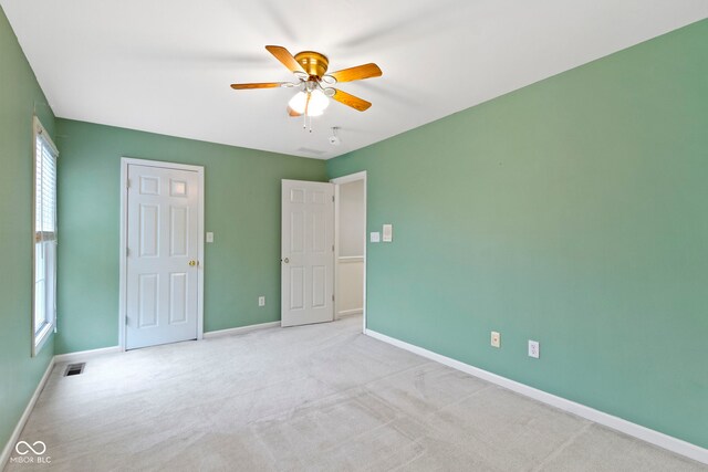 11036 Ravenna Way, Indianapolis, IN 46236 - unfurnished bedroom with baseboards, light colored carpet, and ceiling fan