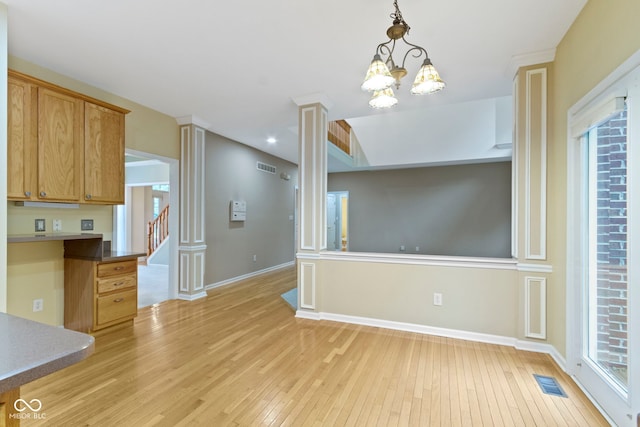 11036 Ravenna Way, Indianapolis, IN 46236 - unfurnished dining area with light wood-type flooring, baseboards, a chandelier, and stairs