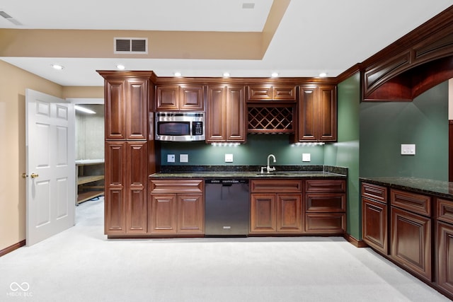 11036 Ravenna Way, Indianapolis, IN 46236 - kitchen with dishwashing machine, stainless steel microwave, recessed lighting, a sink, and light carpet