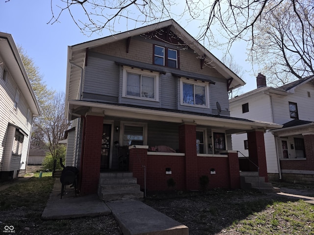2913 Boulevard Pl, Indianapolis, IN 46208 - view of front facade with a porch and brick siding
