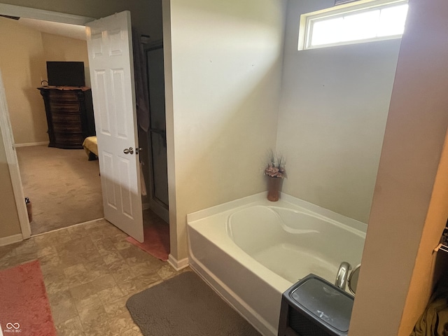2253 Jaybird Dr, Greenfield, IN 46140 - full bathroom with a garden tub and baseboards