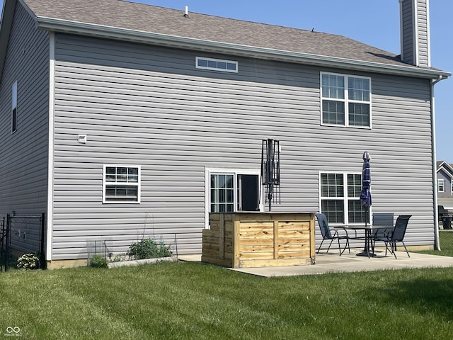 2253 Jaybird Dr, Greenfield, IN 46140 - back of property featuring a chimney and a patio area