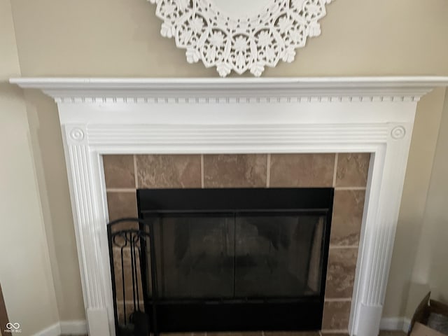 2253 Jaybird Dr, Greenfield, IN 46140 - detailed view of a tile fireplace and baseboards