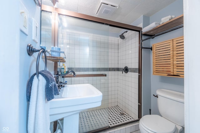 1101 S Rogers St, Bloomington, IN 47403 - full bath with a stall shower, toilet, and tile walls