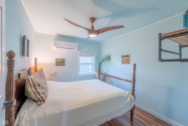 1101 S Rogers St, Bloomington, IN 47403 - bedroom featuring an AC wall unit, wood finished floors, baseboards, and ceiling fan