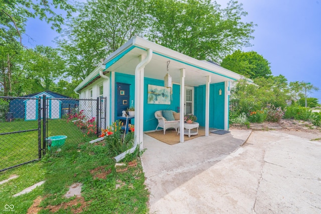 1101 S Rogers St, Bloomington, IN 47403 - view of outbuilding with a gate and a porch