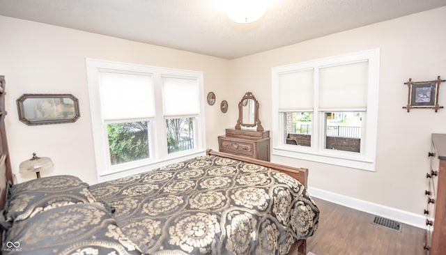 5024 N Kenwood Ave, Indianapolis, IN 46208 - bedroom with baseboards and dark wood-type flooring