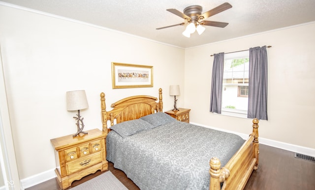 5024 N Kenwood Ave, Indianapolis, IN 46208 - bedroom with dark wood-style floors, crown molding, baseboards, a textured ceiling, and a ceiling fan