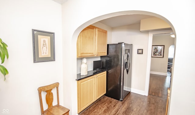 5024 N Kenwood Ave, Indianapolis, IN 46208 - kitchen featuring stainless steel fridge, light brown cabinets, dark wood-style flooring, dark countertops, and baseboards