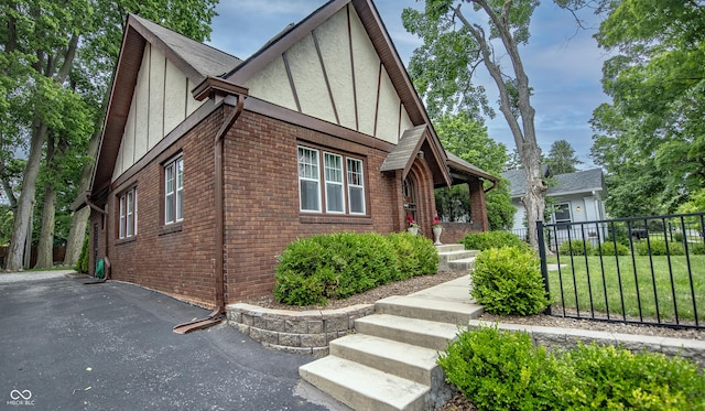 5024 N Kenwood Ave, Indianapolis, IN 46208 - tudor-style house with brick siding and stucco siding