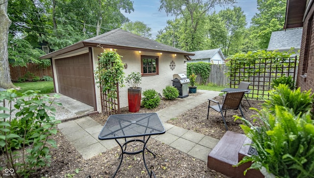 5024 N Kenwood Ave, Indianapolis, IN 46208 - view of patio with a detached garage and grilling area
