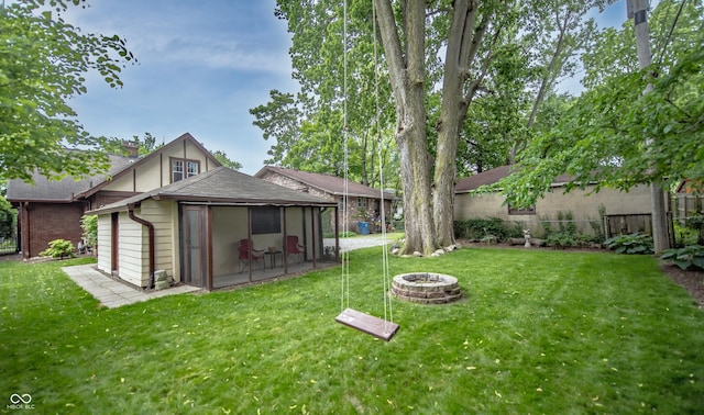 5024 N Kenwood Ave, Indianapolis, IN 46208 - view of yard featuring a sunroom and a fire pit