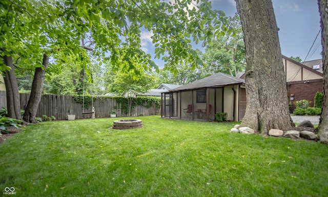 5024 N Kenwood Ave, Indianapolis, IN 46208 - view of yard featuring a sunroom and an outdoor fire pit