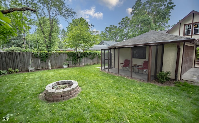 5024 N Kenwood Ave, Indianapolis, IN 46208 - view of yard featuring a sunroom and an outdoor fire pit