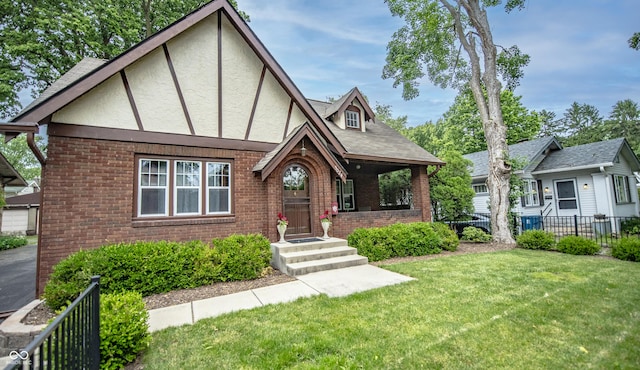 5024 N Kenwood Ave, Indianapolis, IN 46208 - tudor-style house featuring brick siding and stucco siding