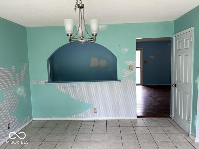 8045 Briarwood Dr, Indianapolis, IN 46227 - unfurnished dining area featuring baseboards, a chandelier, and tile patterned flooring