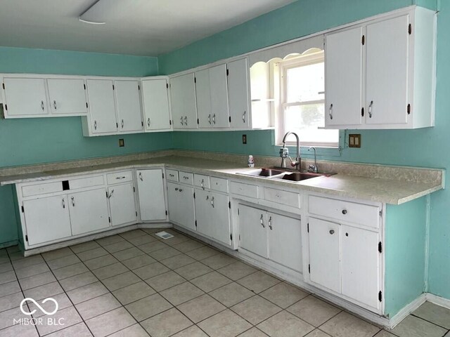 8045 Briarwood Dr, Indianapolis, IN 46227 - kitchen featuring a sink, light countertops, and white cabinetry