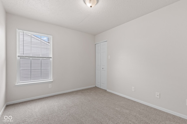 2270 Collins Way, Greenfield, IN 46140 - carpeted empty room featuring a textured ceiling and baseboards