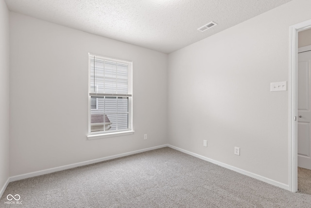 2270 Collins Way, Greenfield, IN 46140 - spare room featuring carpet flooring and a textured ceiling