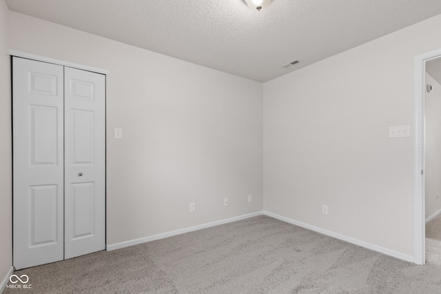 2270 Collins Way, Greenfield, IN 46140 - unfurnished bedroom with carpet flooring, a textured ceiling, and a closet