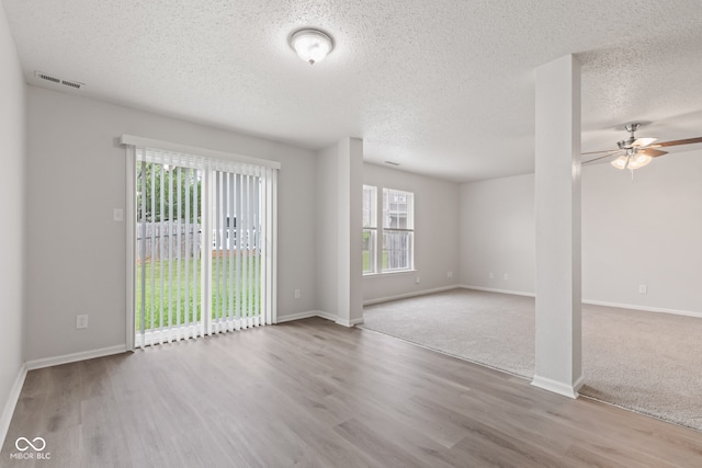 2270 Collins Way, Greenfield, IN 46140 - empty room with wood finished floors, a textured ceiling, and ceiling fan