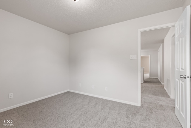 2270 Collins Way, Greenfield, IN 46140 - carpeted empty room with baseboards and a textured ceiling