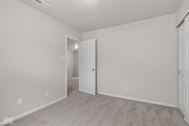 2270 Collins Way, Greenfield, IN 46140 - unfurnished bedroom with carpet flooring, a textured ceiling, and a closet